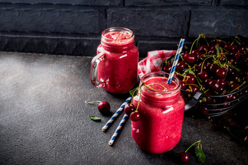 Summer fruity vitamin drink. homemade cherry smoothie on dark background