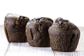 three chocolate cupcakes