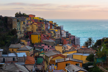 Fototapeta premium Manarola at sunrise, one of colorful villages of Cinque Terre, Italy