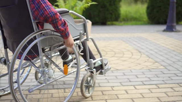 Close up of a disabled person who uses a wheelchair