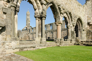 Fototapeta na wymiar Looking through a series of arches at the ruined St Andrews cathedral on a bright, sunny day. St Andrews, Fife, Scotland.