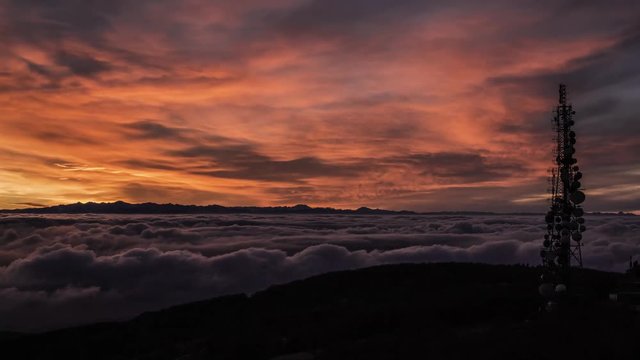 timelapse over the clouds during a sunset