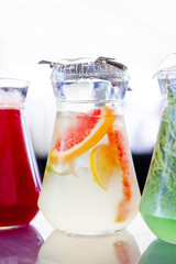 fruit drinks in decanters and glasses