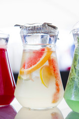 fruit drinks in decanters and glasses