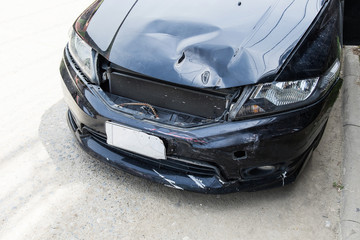 Front of black car accident bonnet damage, Insurance concept.
