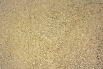 View of sand. Background with copy space and visible sand texture.
