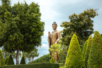 Beautiful buddhist temple (Phra Bbuddha Metta Pracha Thai Trailokanath)traditional in Thailand with mountain. (Wat Thipsukhontharam landmark of Kanchanaburi)