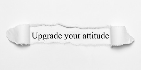 Upgrade your attitude on white torn paper