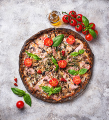Italian pizza on black dough. Trendy food