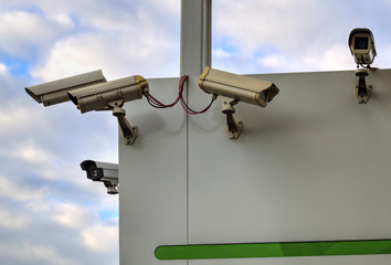 Security cameras on white wall closeup