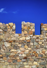 Colorful stone wall and blue sky