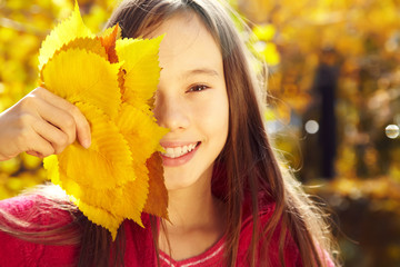 smiling teenage girl in autumn