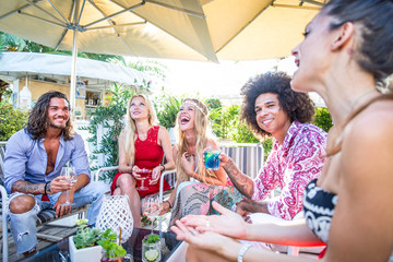 Friends making party in a lounge bar