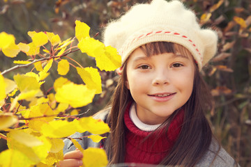 smiling girl in autumn