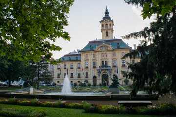 Fototapeta na wymiar Looking across Széchenyi Park to the Town Hall of Szeged, Hungary