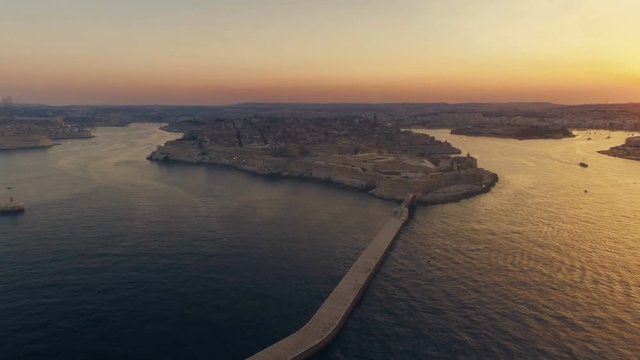 Aerial shot looking towards the Capital city Valletta at Sunset in Malta