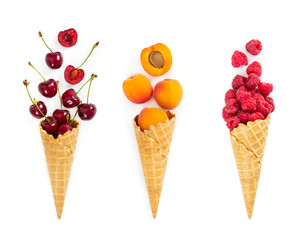 Set of assorted berries and fruit in waffle ice cream cone. Concept of healthy eating.