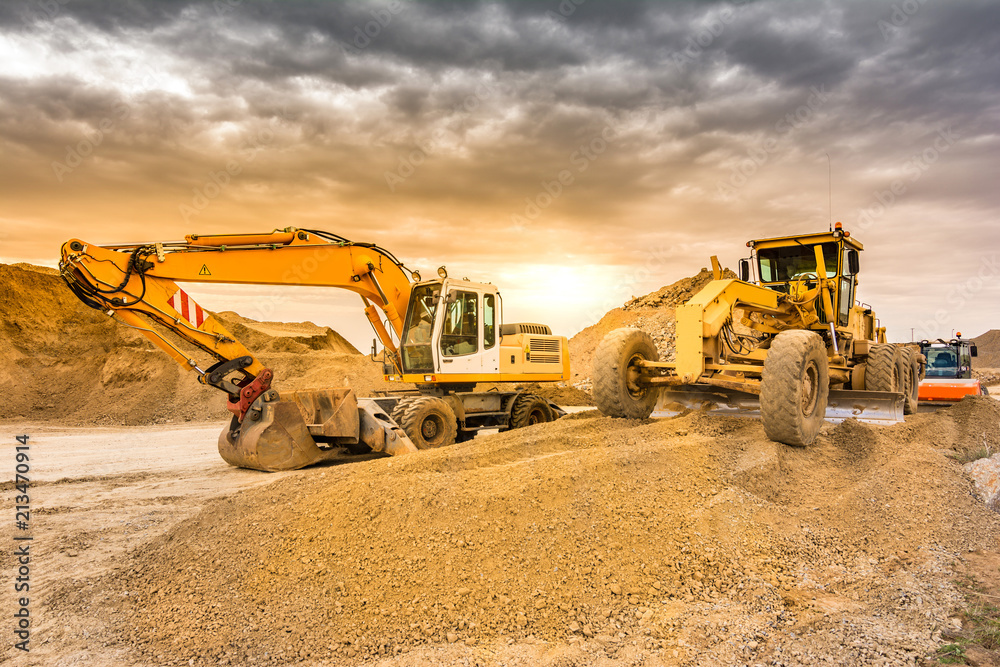 Wall mural Excavator working on the construction of the extension works of the Madrid - Segovia - Valladolid highway (Spain)