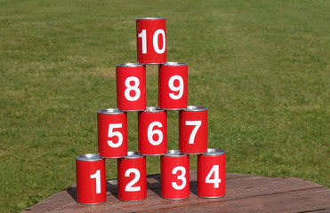 Tin cans shooting target game with numbers one to ten