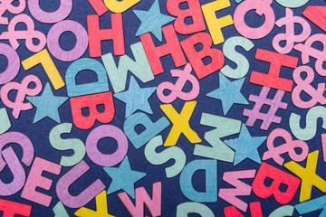 Background of mixed colorful English alphabets.