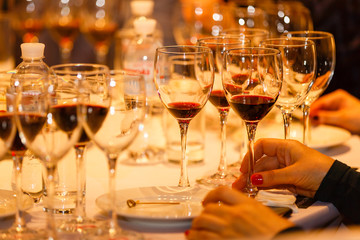 White wine pouring into glasses, closeup