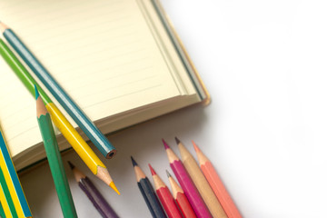 Fototapeta premium Many color pencils are already used on white paper.