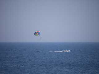 color parachute stretched to a boat rope, entertainment for tourists at sea
