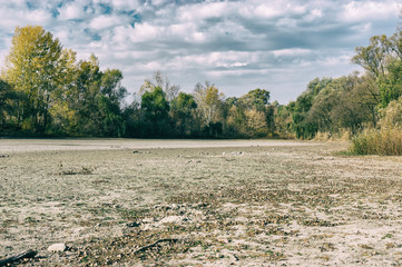 Autumnal landscape with dried up lake in village Pidstavky, Sumskaya oblast, Ukraine
