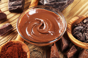 Melting chocolate  or melted chocolate with a chocolate swirl. Many stack and chips with powder.