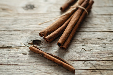 a cinnamon is spicy fragrant on a table with a mestome for a background