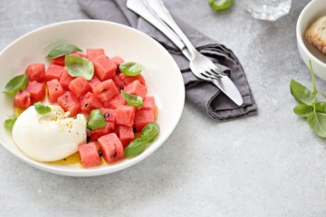 Watermelon Mozzarella Salad with basil and olive oil. Selective focus