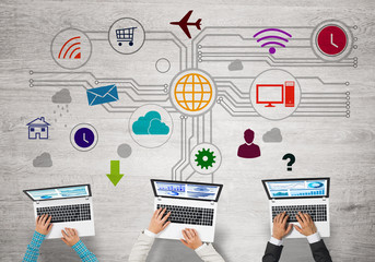 Top view of businesspeople sitting at table and using gadgets