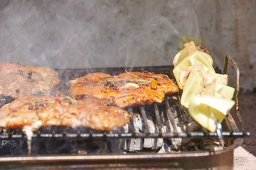 Slices of raw and grilled pork meat