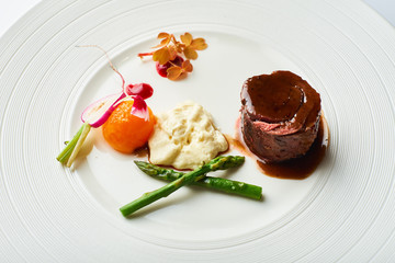 poultry roulade with mashed potatoes and asparagus