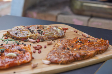 Slices of raw and grilles pork meat