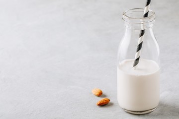 Homemade almond milk in a glass bottle.