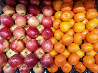 Fresh colorful fruits lined up on a market