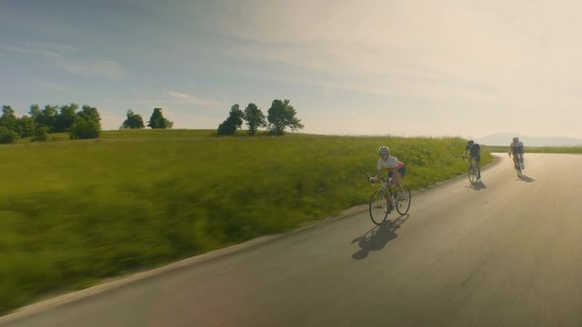 Tracking shot of group of riders