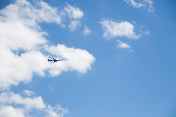 Obraz premium Image of flying airplane in clear sky with sun at background