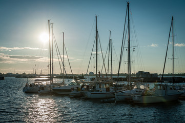 Fototapeta na wymiar Baltic Sea bay with yachts at sunset at Tallinn, Estonia. Seaplane Harbour Tallinn.