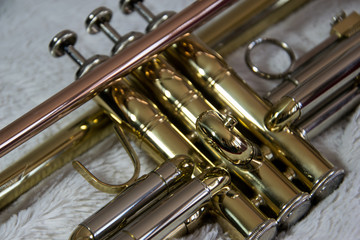 Close up of the trumpet, valves only, diagonally, brass