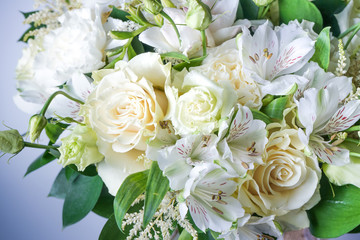 beautiful wedding bouquet with white roses and other flowers on wooden background  with 2 wooden pigeons