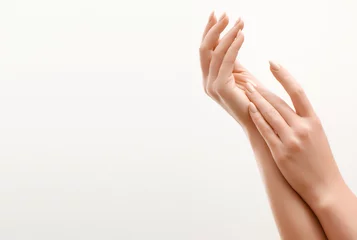 Poster Beautiful Woman Hands. Female Hands Applying Cream, Lotion. Spa and Manicure concept. Female hands with french manicure. Soft skin, skincare concept. Hand Skin Care. © looking2thesky