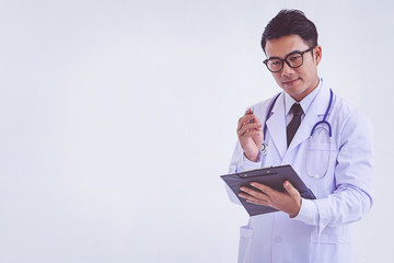 Doctor holding a clipboard with prescription