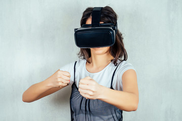 Indian girl with virtual reality glasses is very surprised