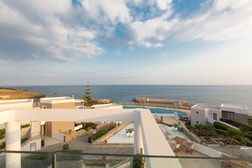 Outdoor hotel swimming pool with sunbeds around