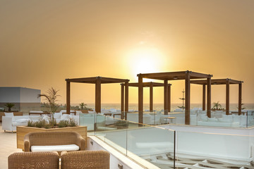 Sunset in cafe bar in sea hotel resort