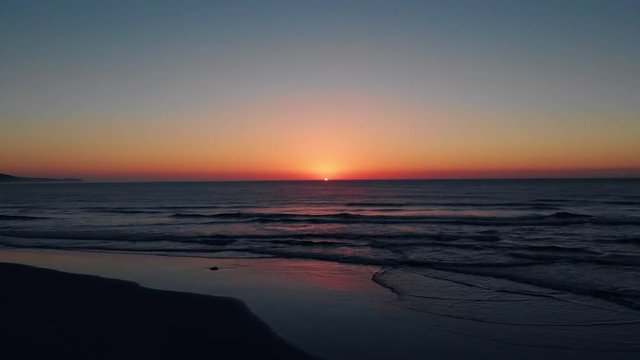 Beautiful sunrise over the ocean. Crack of dawn sunrise with clear skies
