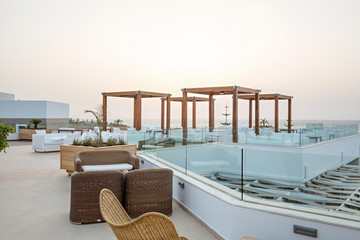 Sunset in cafe bar in sea hotel resort
