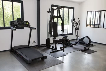 Fotobehang Fitness Private gym at home interior with different sport exercise equipment